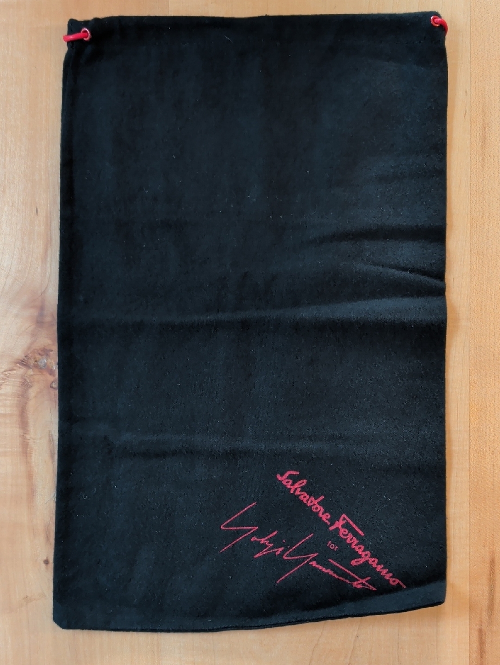 Salvatore Ferragamo Black Drawstring Pouch with Red Logo Accents